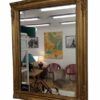 Miroir mural ancien doré en bois avec sculptures florales